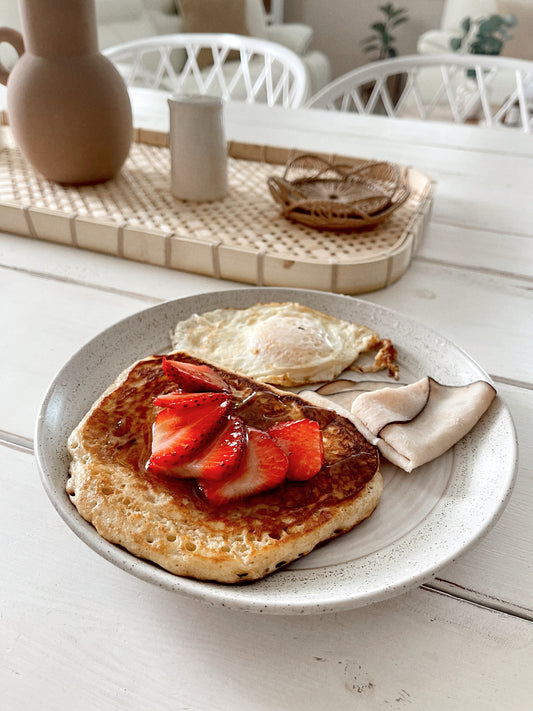 Image of pancakes with strawberries on top